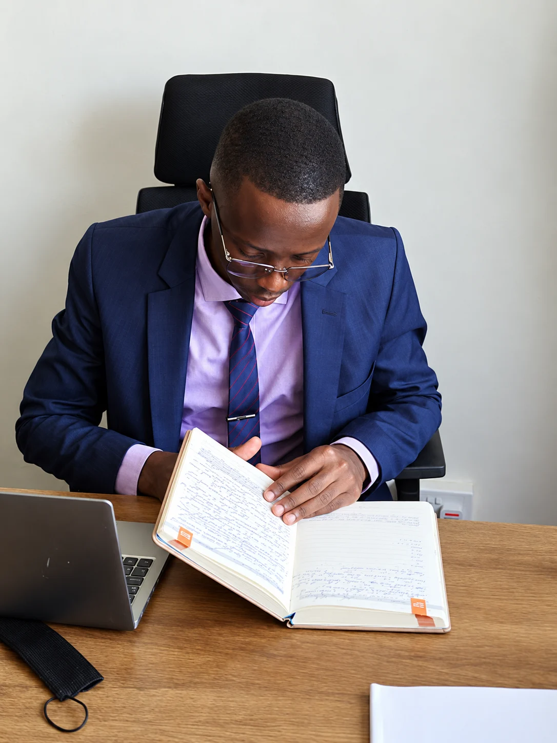 Achola Odhiambo reviewing a legal document